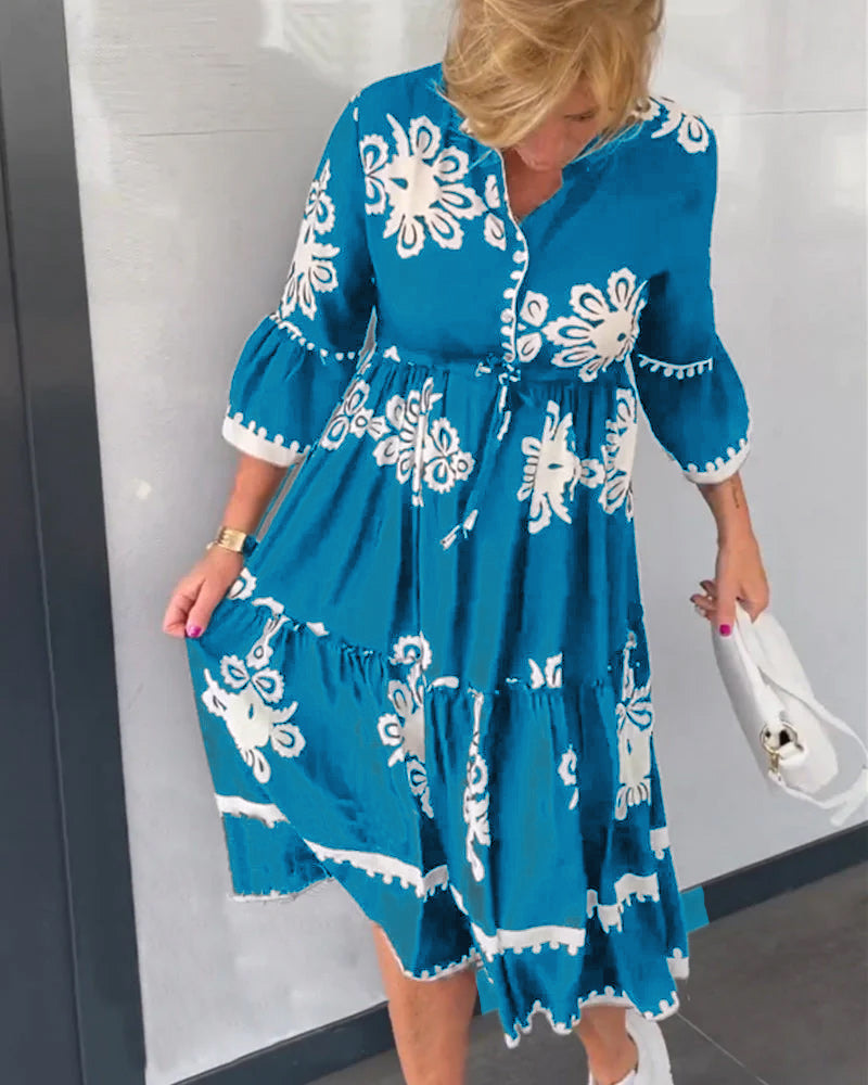 Elegante bloemenjurk met 3/4 mouwen