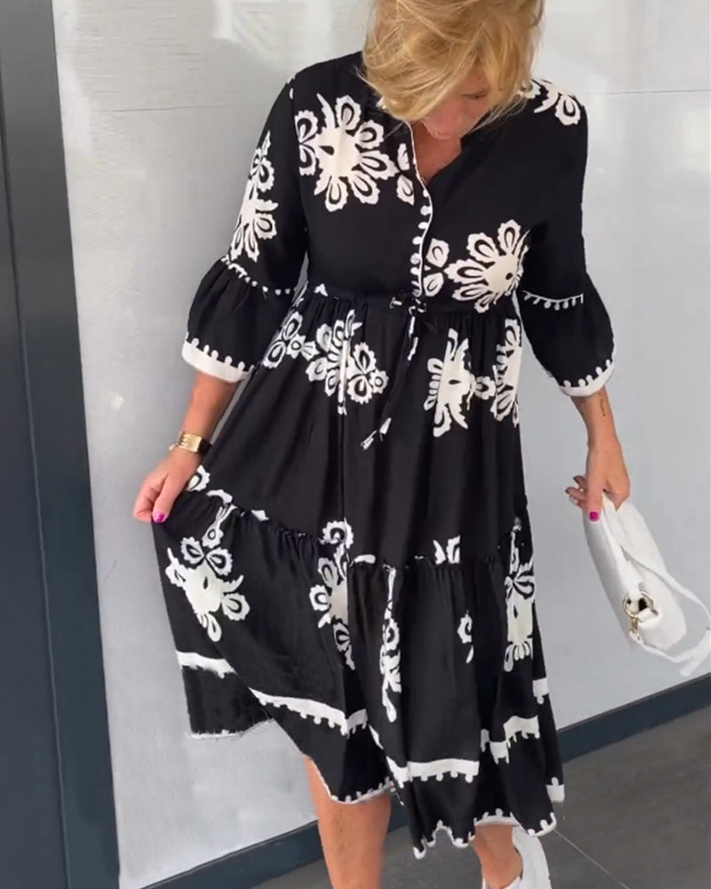 Elegante bloemenjurk met 3/4 mouwen