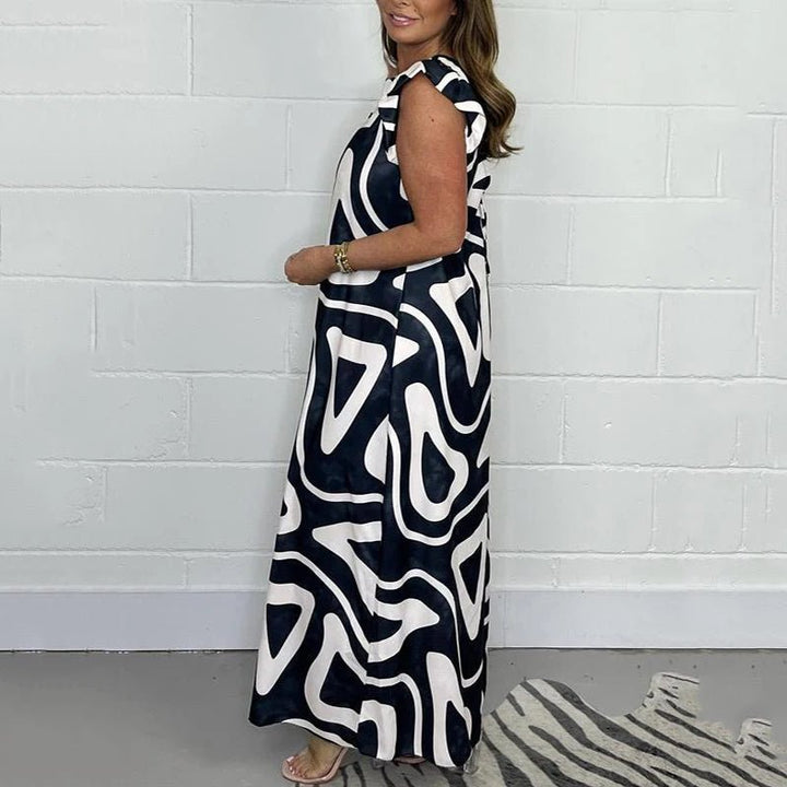 Nova | Dames Abstracte Print V-Hals Ruffle Mouw Wijde Pijpen Jumpsuit
